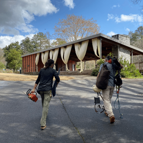 Volunteers carrying equipment into Chattahoochee Nature Center